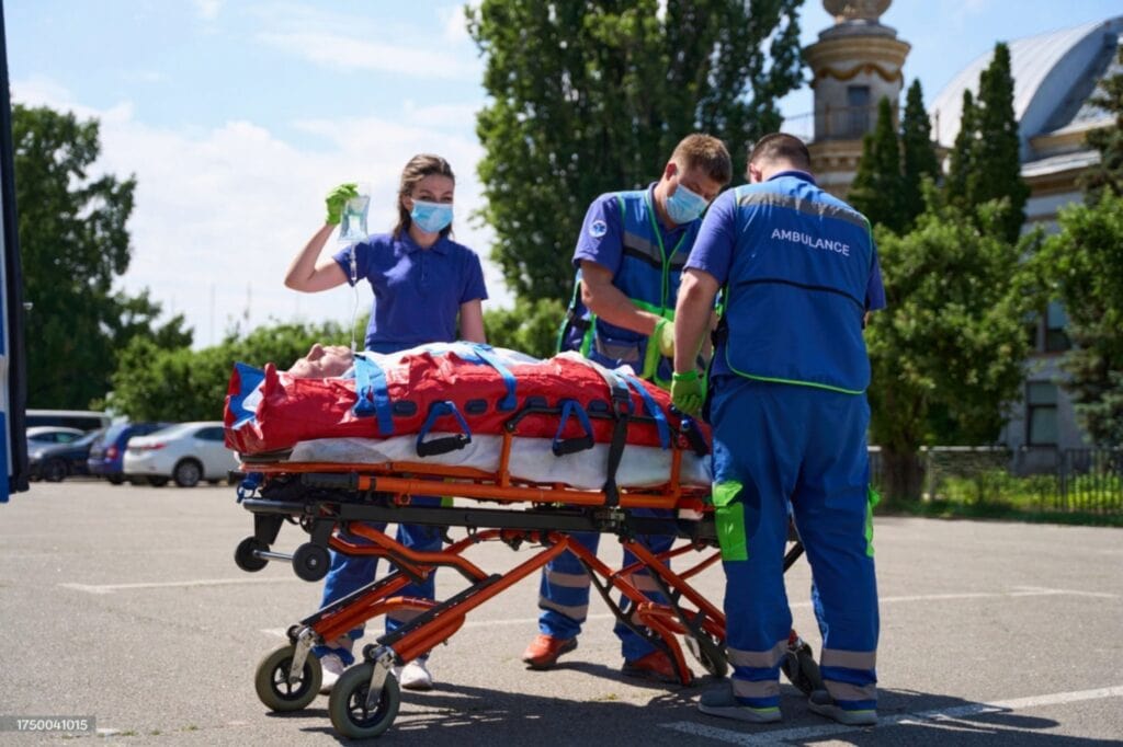 Patient transport with vacuum stretcher by ambulance team in emergency care