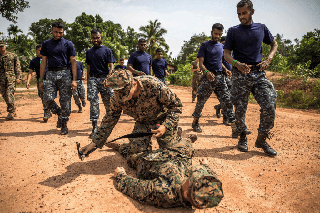 Soldier applying tourniquet during field training