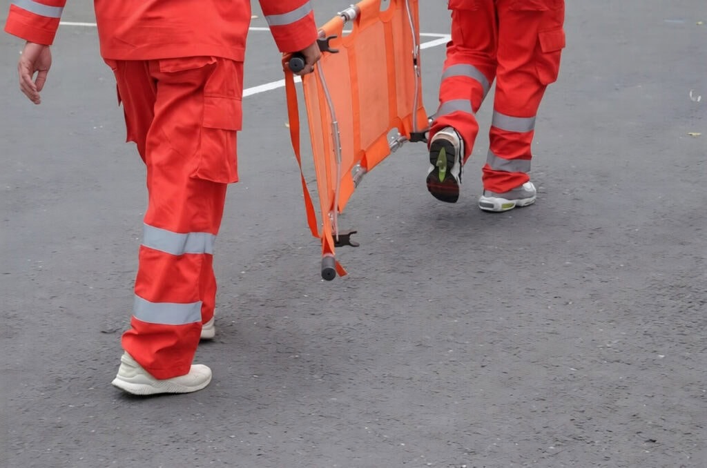 paramedics carrying folding stretcher