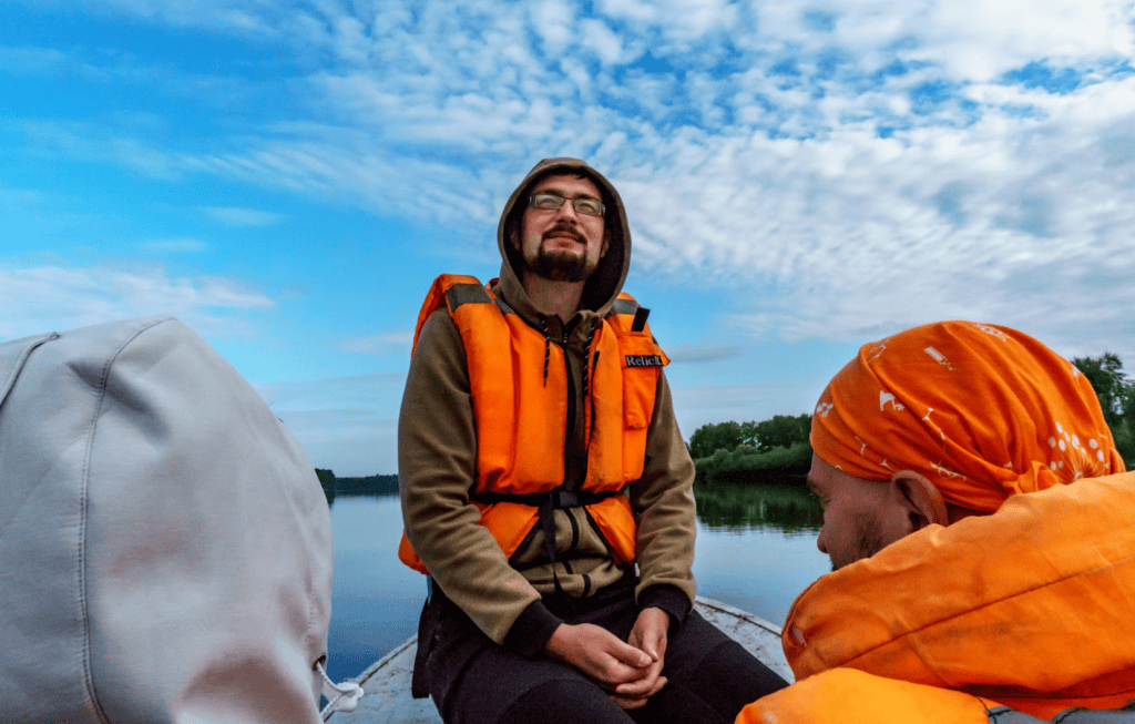Man in life jacket on boat ride