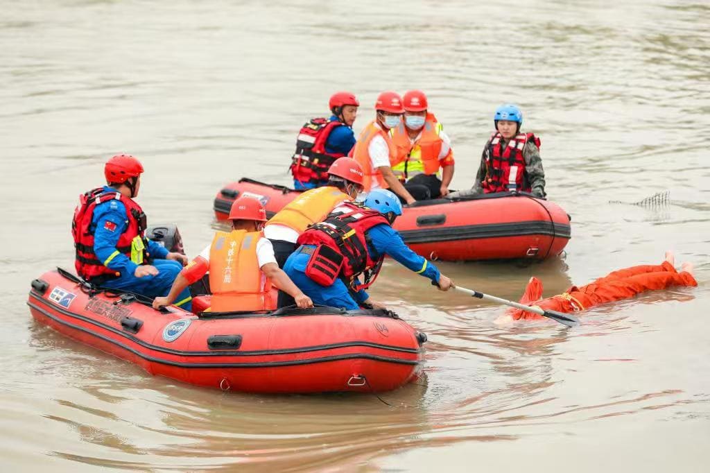 Rescue crew conducts water operation in inflatable boats